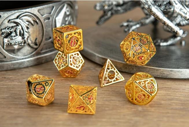 Gold with Red Enamel Hollow Metal Gears of Providence Polyhedral Dice Set